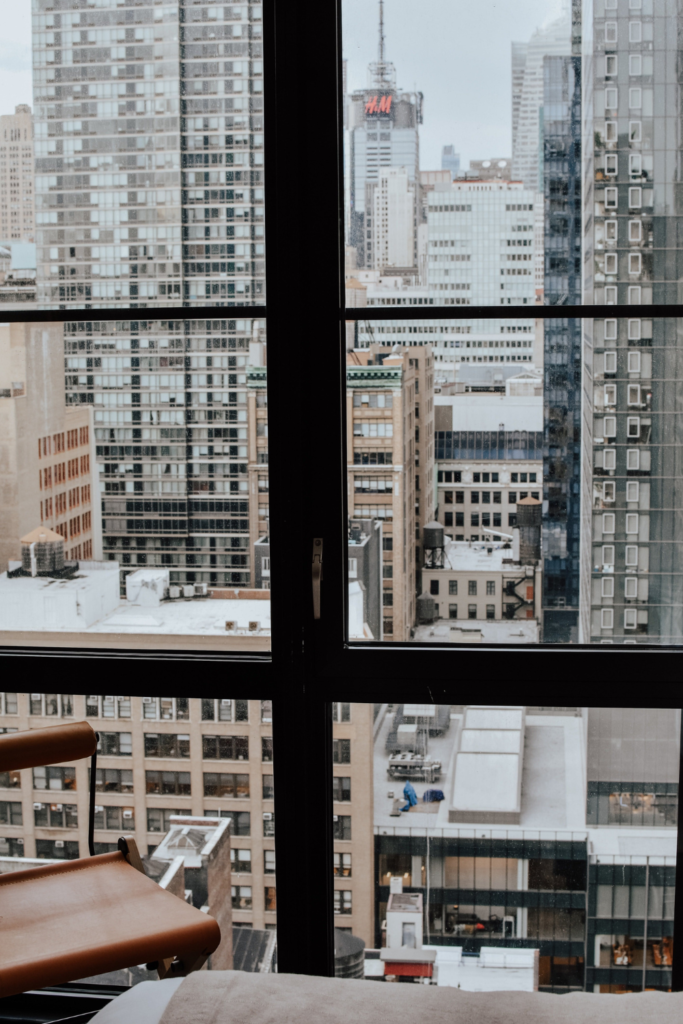 Airbnb window view of snow covered city