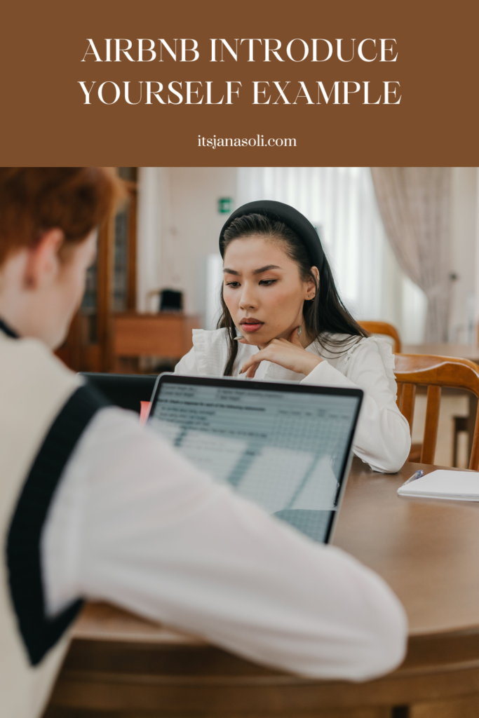 Image of two adults sitting at table with tablets