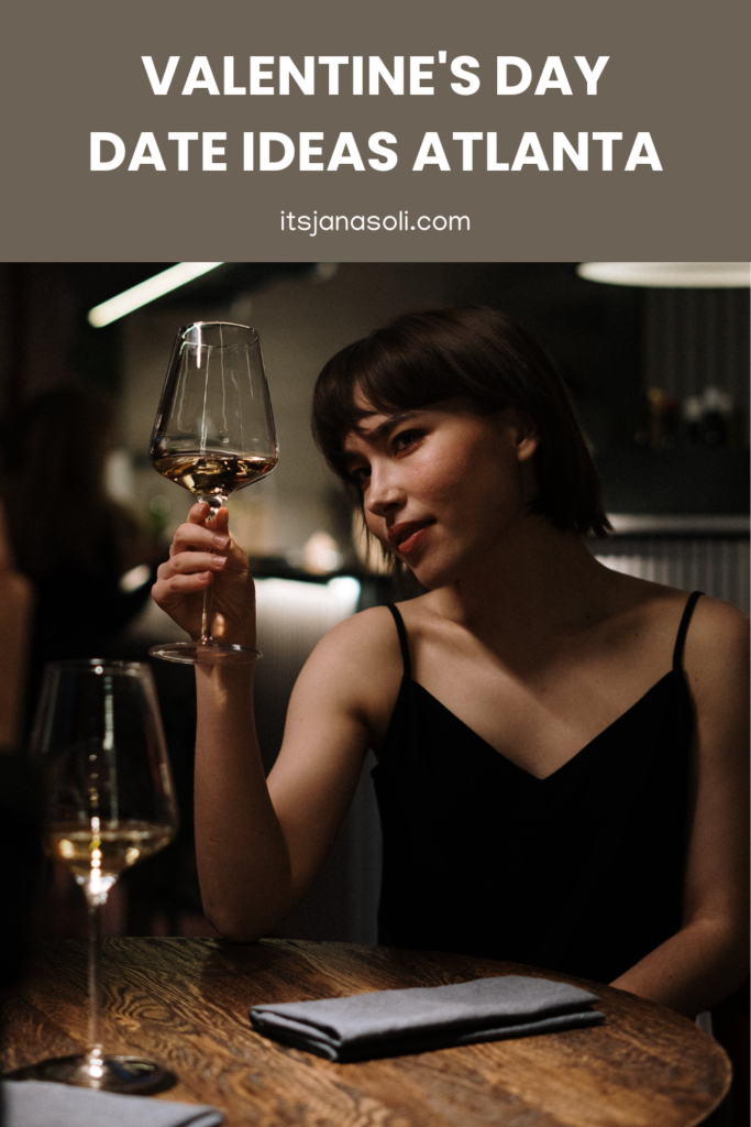 Image of woman with black hair holding wine glass in restaurant