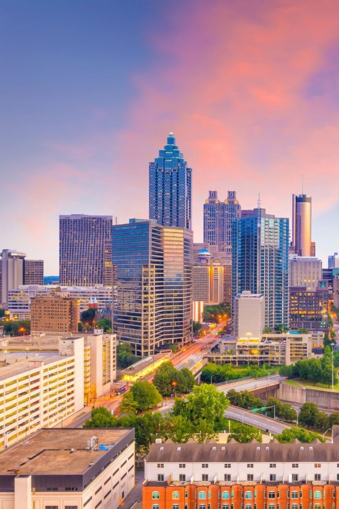 image of skyscrapers in Atlanta, Georgia at sunset with pink and purple sky