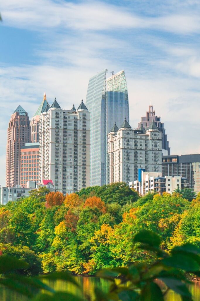 image of midtown atlanta over the tree line in piedmont park