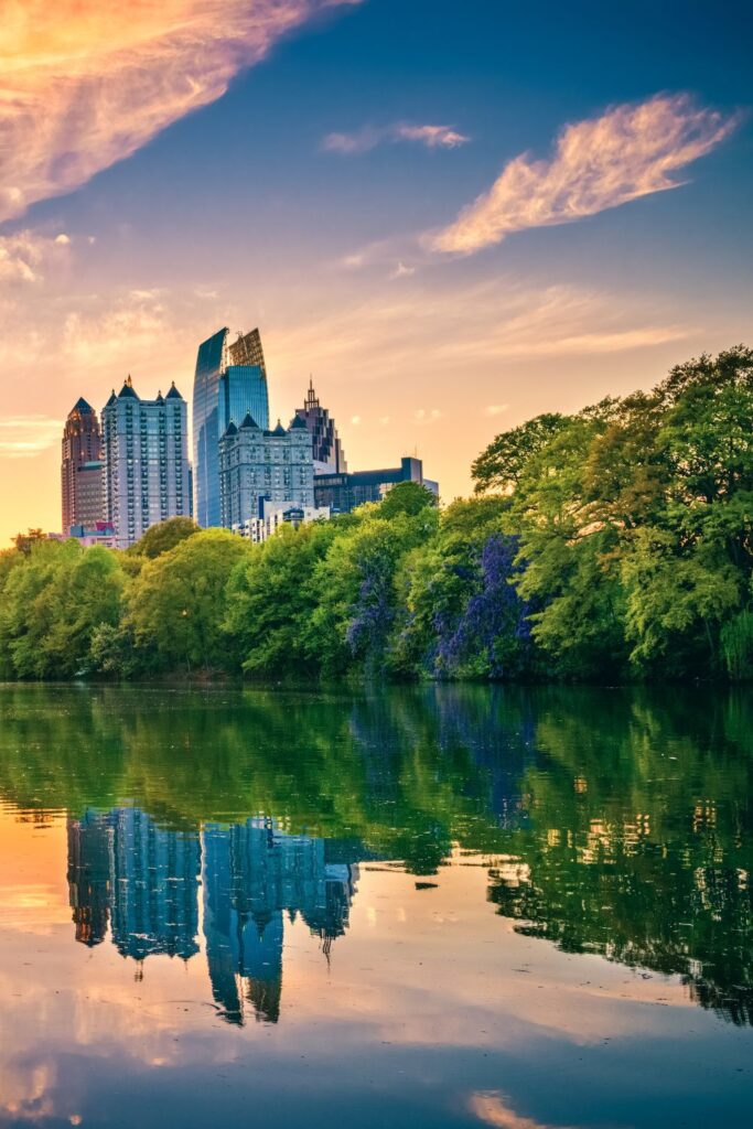 image of pond in piedmont park looking toward midtown