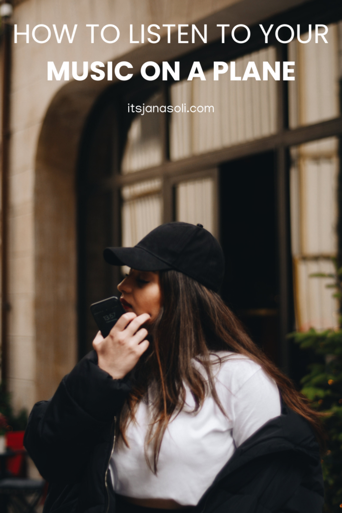 image of woman with black hat holding a cell phone