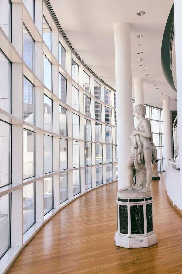 image of interior hall of art at the High Art Museum, with large windows to the left letting in sunlight