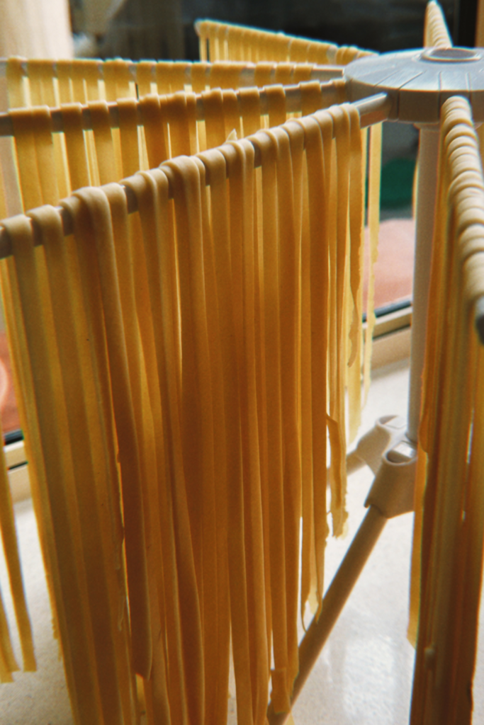 Image of hand made pasta hanging to dry