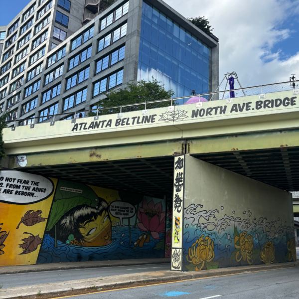 Image of the walkway over North Avenue NE in Old Fourth Ward Atlanta. The image shows a colorful mural painted underneath the overpass