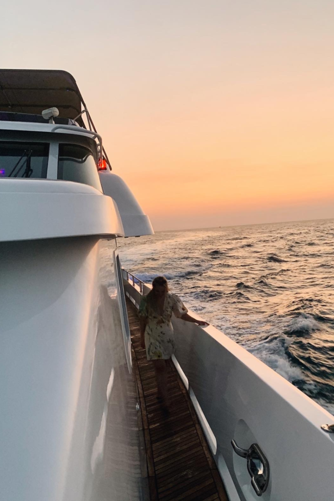 Image of a yacht at sunset during a charleston sc sunse cruise in charleston harbor