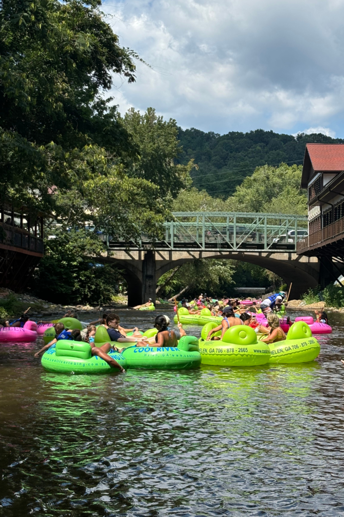 Image of people floating down Chattahoochee River on tubes in Helen GA