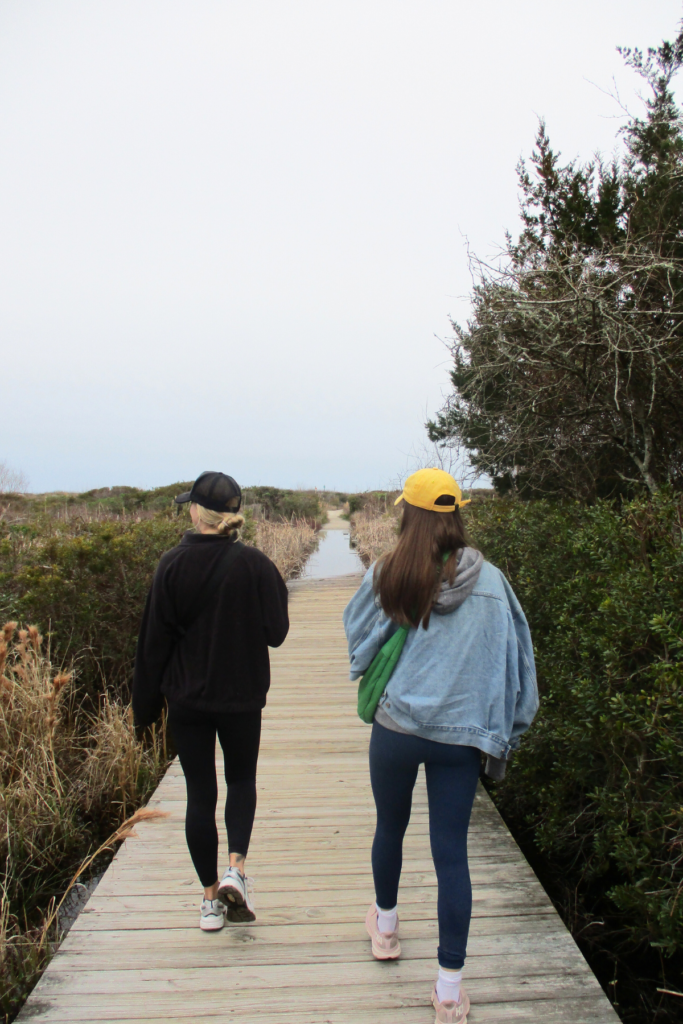 Image of 2 people walking along board walk on their road trip from Charleston SC to Beaufort SC