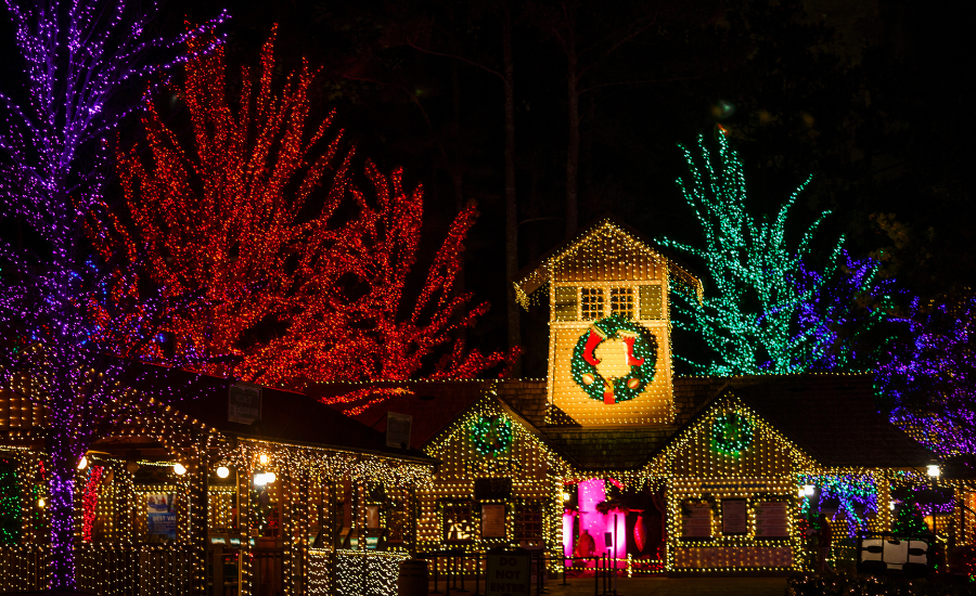 Image of Christmas light displays at Stone Mountain Christmas. Colorful lights adorn buildings at Stone Mountain.