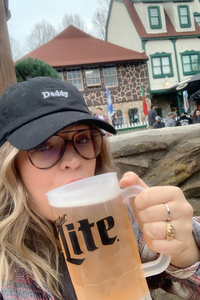 Sipping beer at a beer garden during a Helen GA romantic weekend itinerary