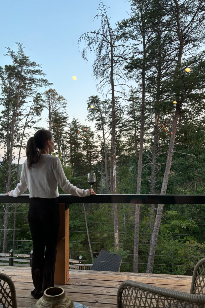 Relaxing on the private balcony of Yonah Suite during a Helen GA romantic weekend itinerary