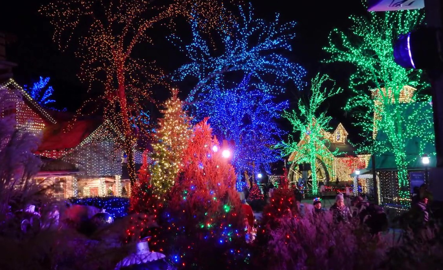 Image of Christmas light displays at Stone Mountain Christmas. Colorful lights adorn trees and buildings at Stone Mountain.