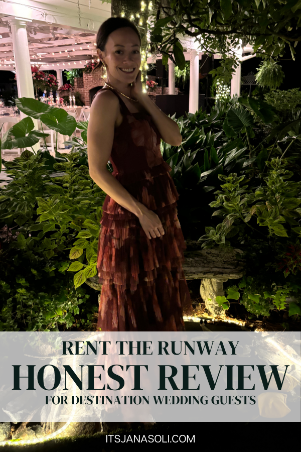 Image of woman in long maroon colored dress standing in front of a garden at a wedding.