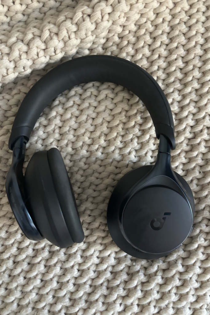 Image of Soundcore headphones on tan blanket.